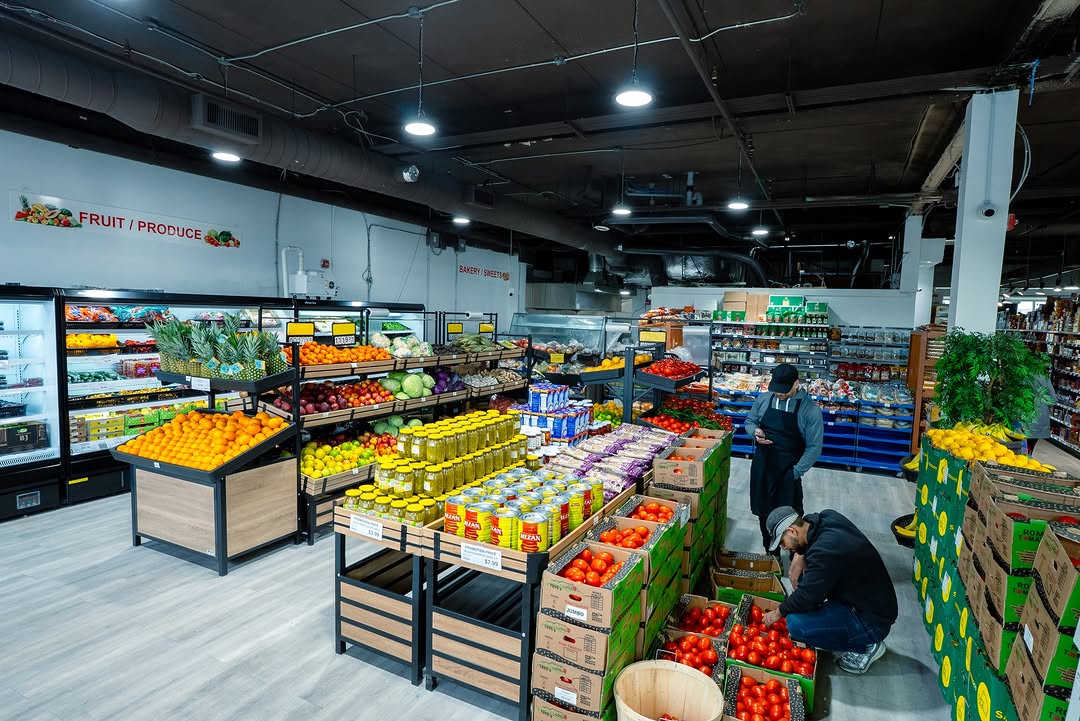 Inside Tomatoes Bazar — Milton's neighbourhood grocery store with fresh produce, bakery, and aisles